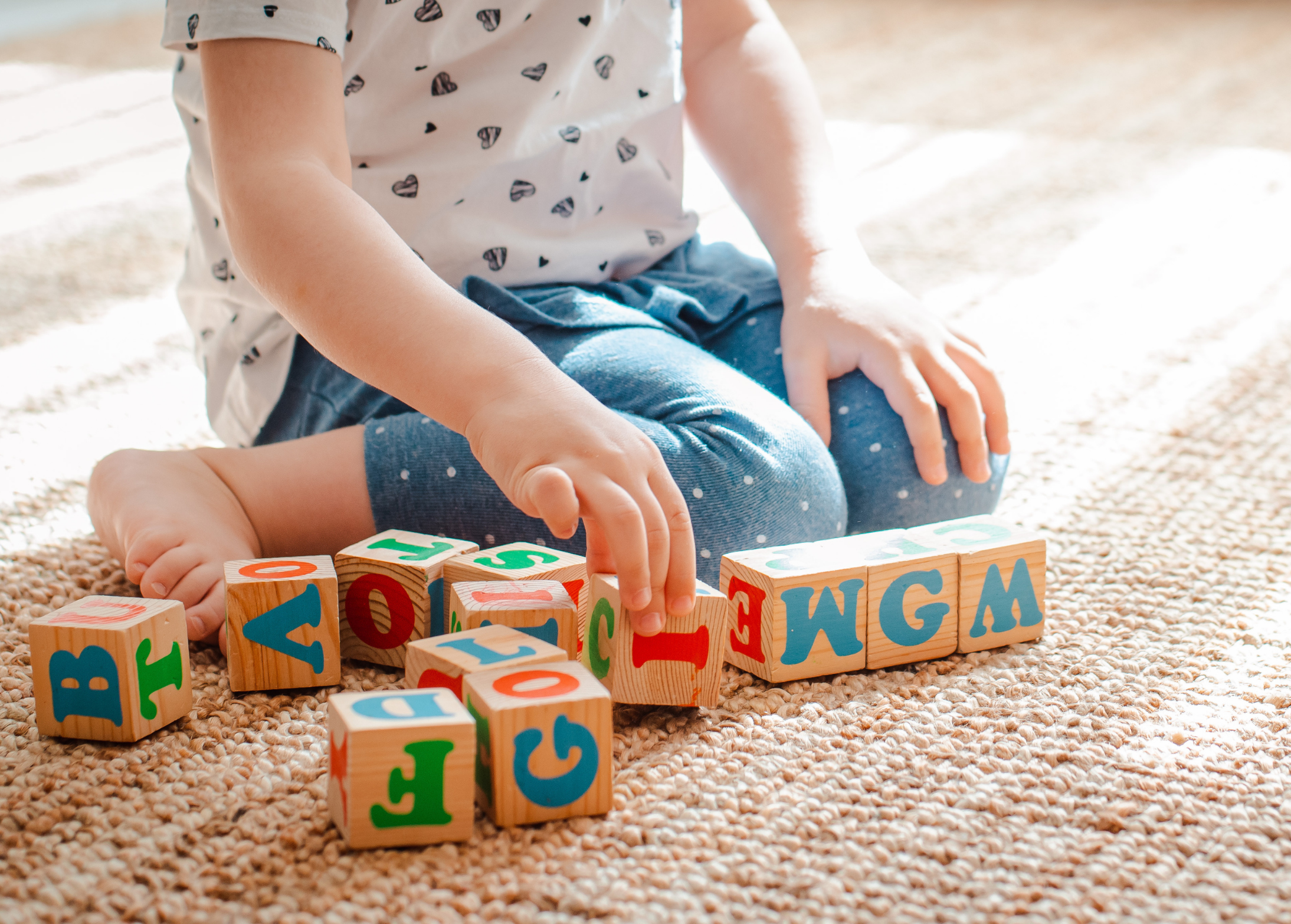 Child plays with blocks at a child care centre