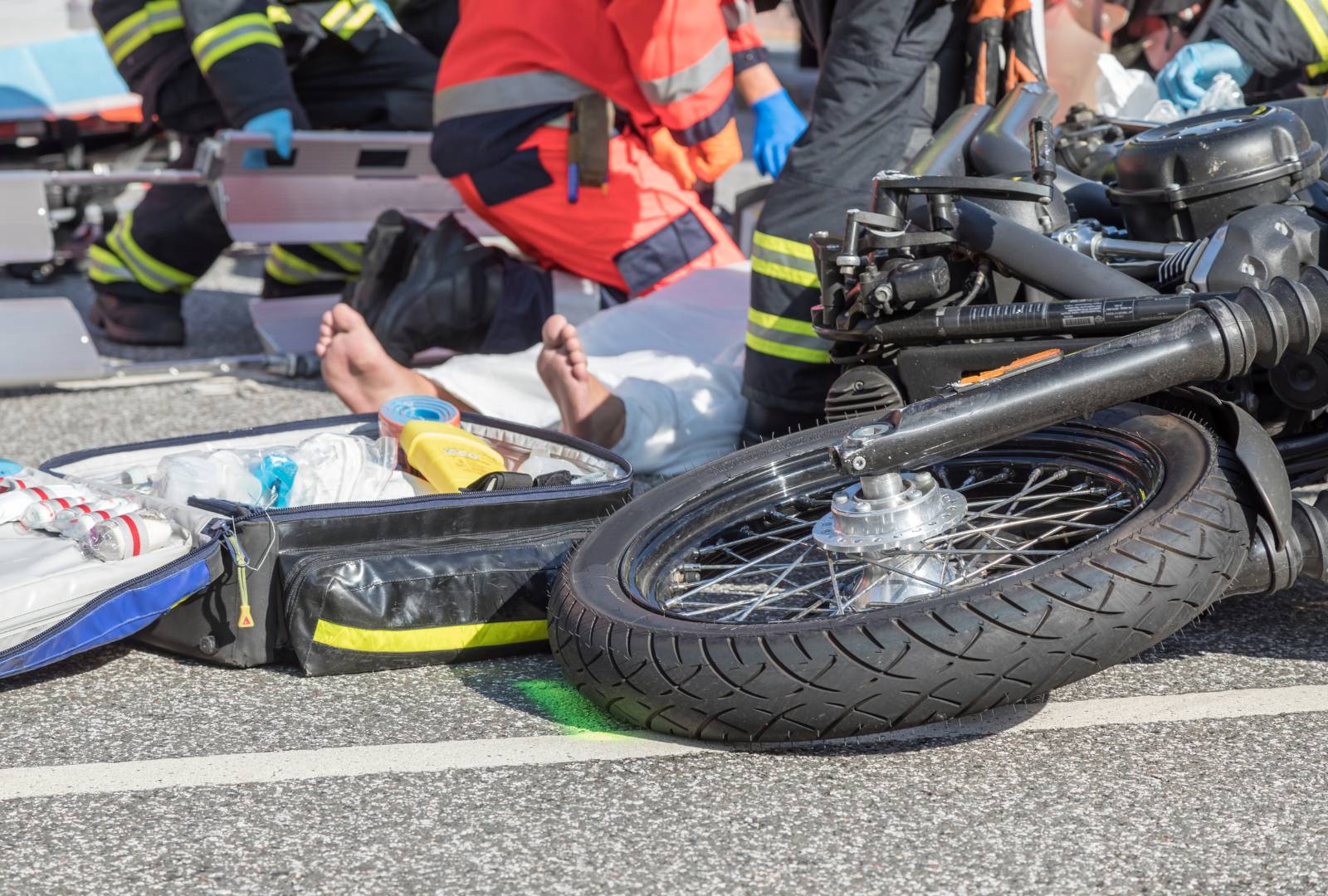 Man on the road after a motorbike accident